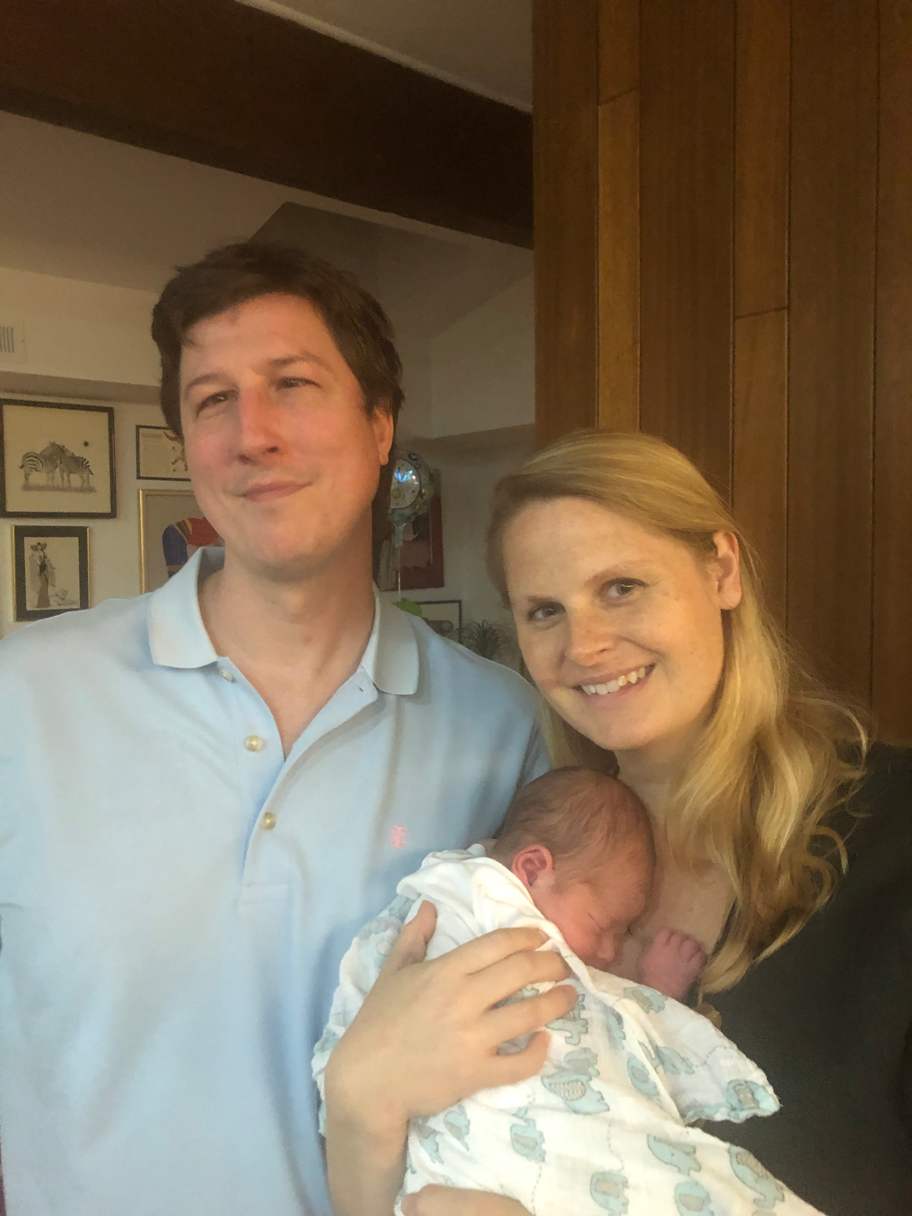 Eve Wicker and her husband with their new son.