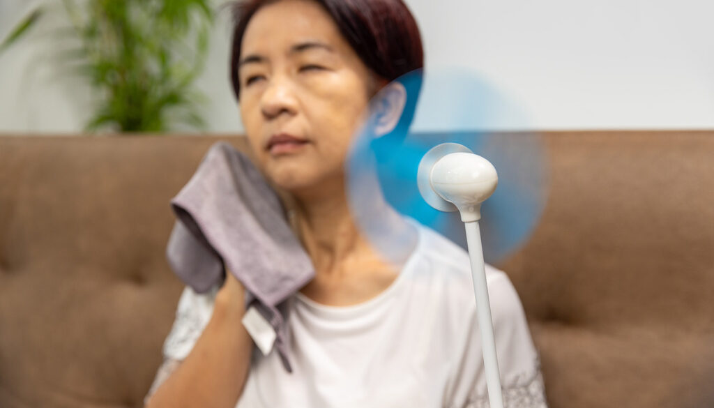 Senior Asian Woman Experiencing Signs of Menopause