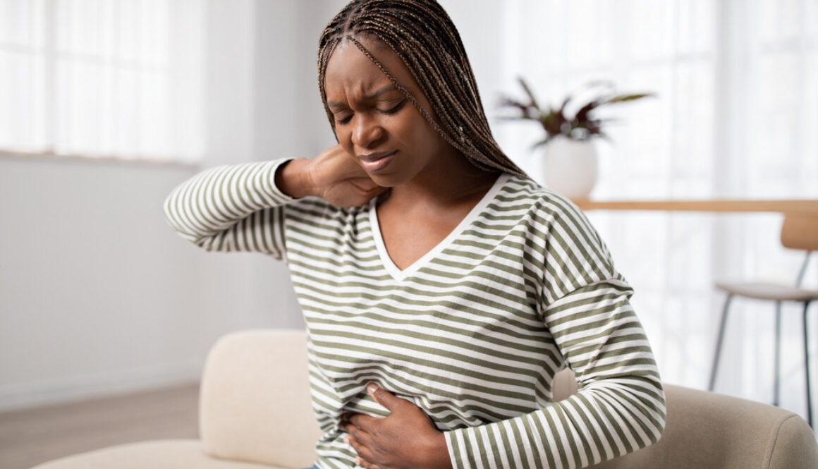African-American Woman Wonders What Are Fibroids as She Has Difficult Menstrual Cramps