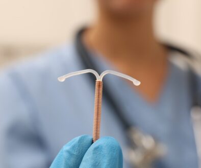 Closeup of a Female Doctor Holding an IUD Can You Remove Your IUD Yourself
