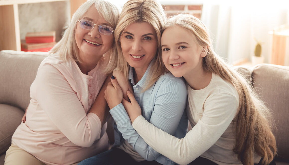 Three Generations of Women in a Family Sitting on a Couch Hugging Each Other Is Endometriosis Genetic